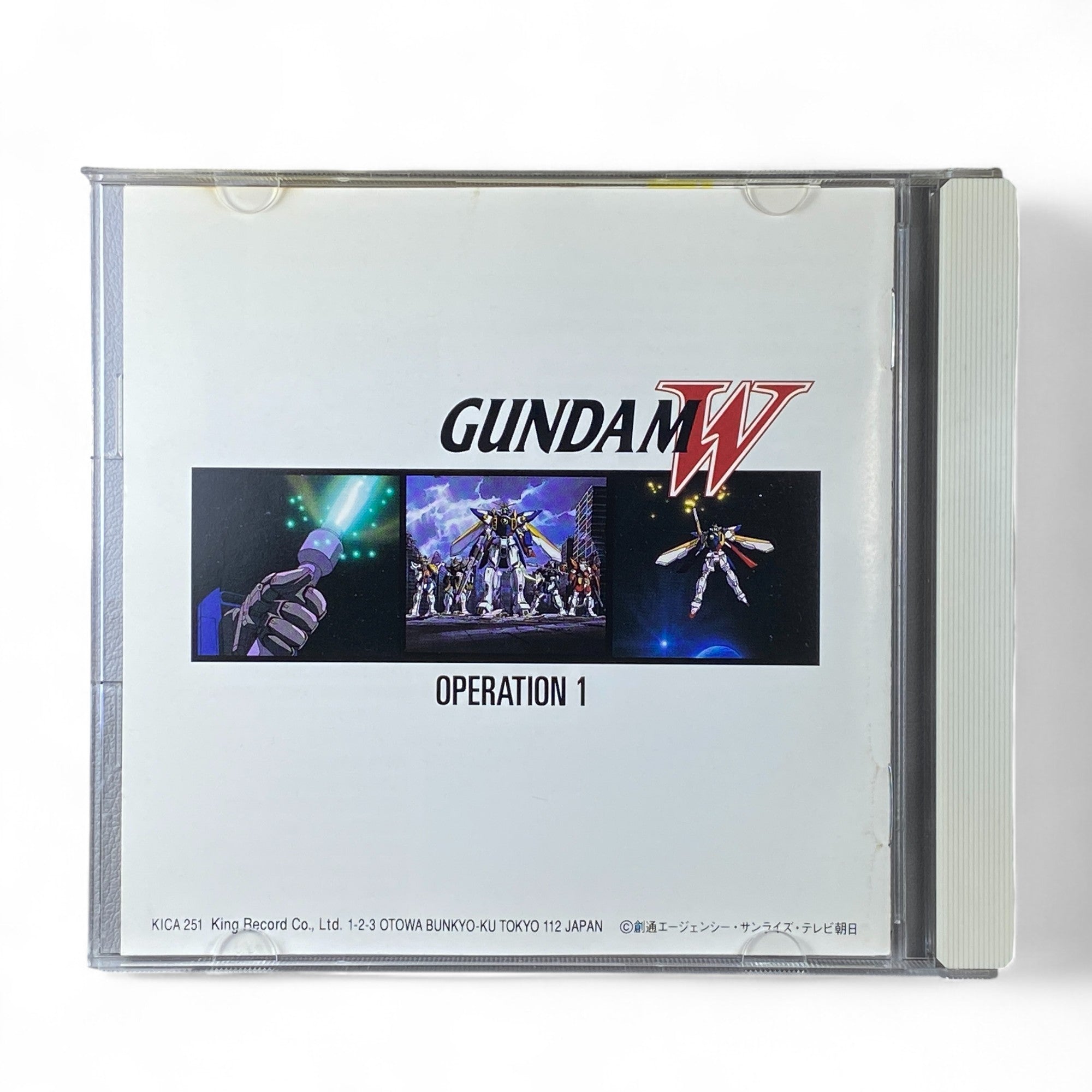 Gundam Wing Operation 1 soundtrack CD cover featuring the Gundam Wing mobile suit
