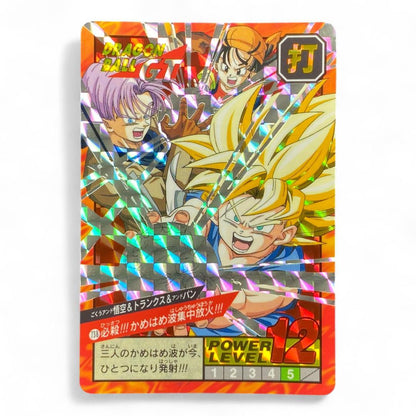 Dragon Ball GT prism card with Goku, Trunks, and Pan performing triple Kamehameha
